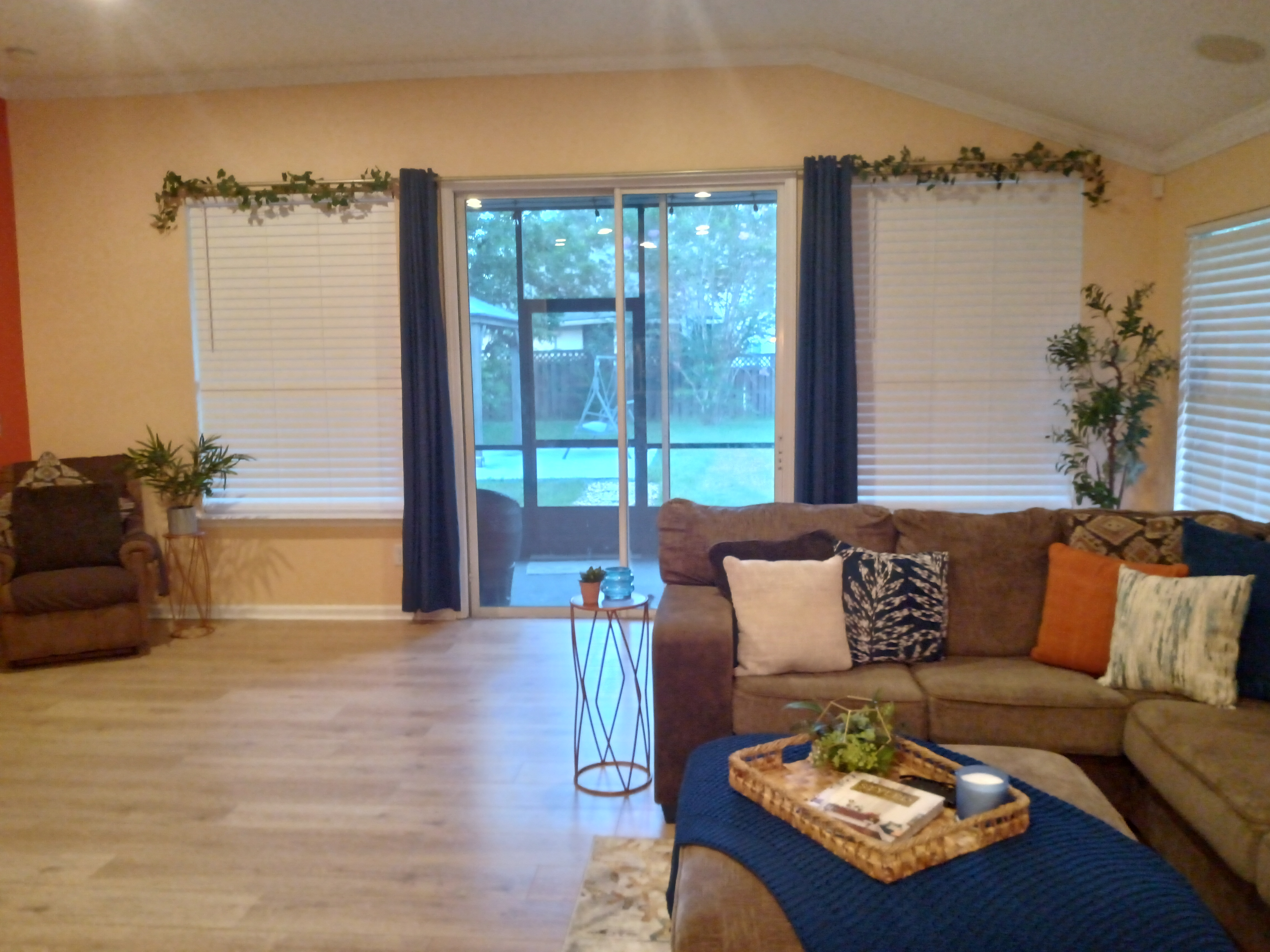 Living room with navy curtains and ivy garland
