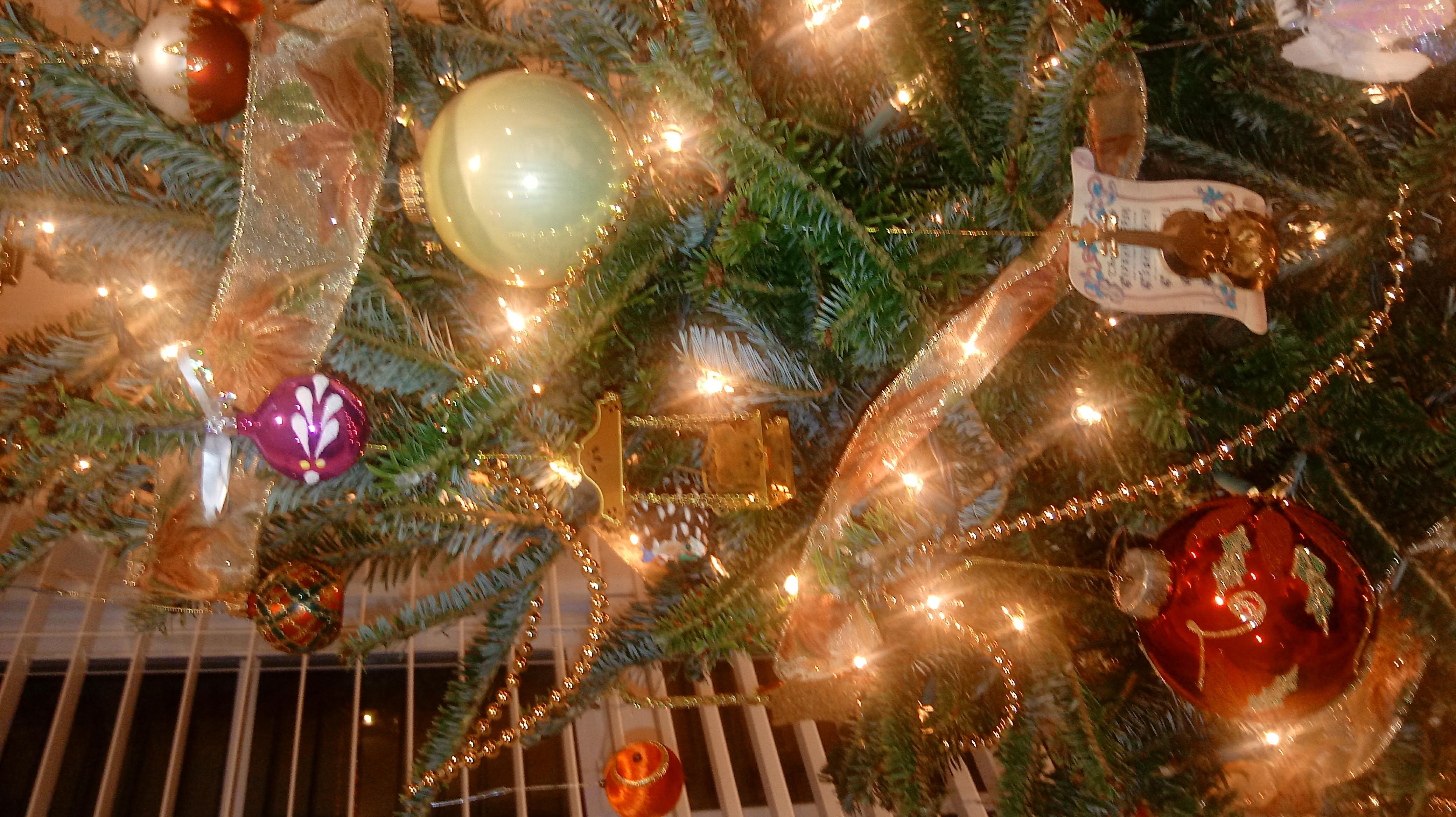 Decorated Christmas tree with ornaments and warm lights